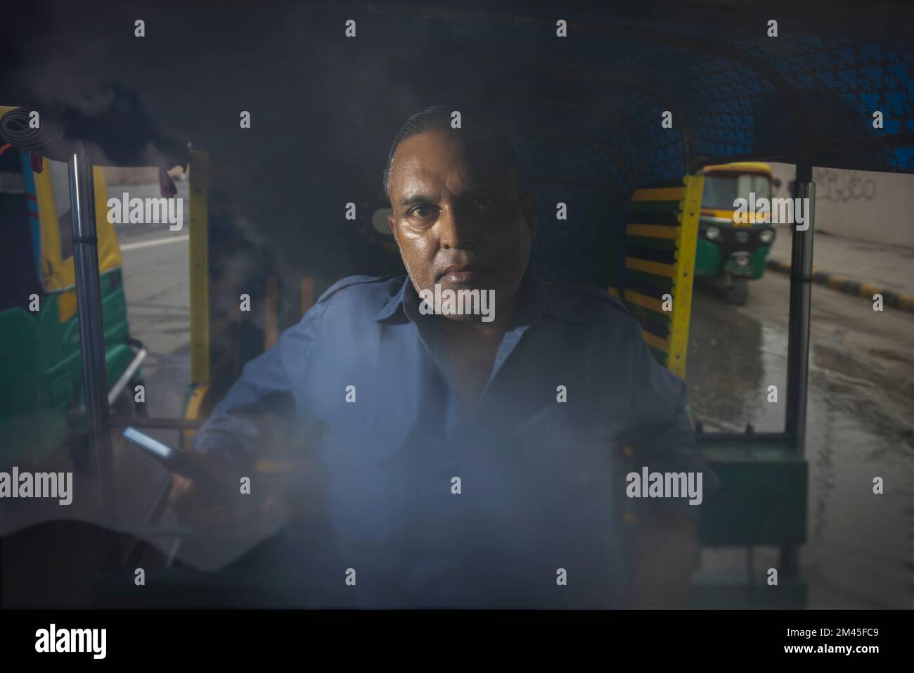 Auto rickshaw using mobile hi-res stock photography and images - Alamy