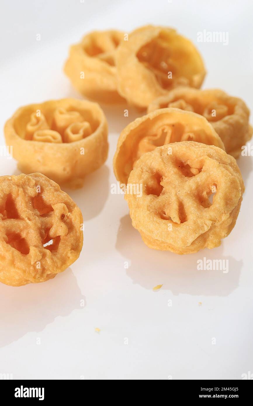 Kue Kembang Goyang or Kuih Loyang, Indonesian and Malaysian Traditional Crispy Snack, Deep Fried Shaped Flower Rice Cracker Stock Photo
