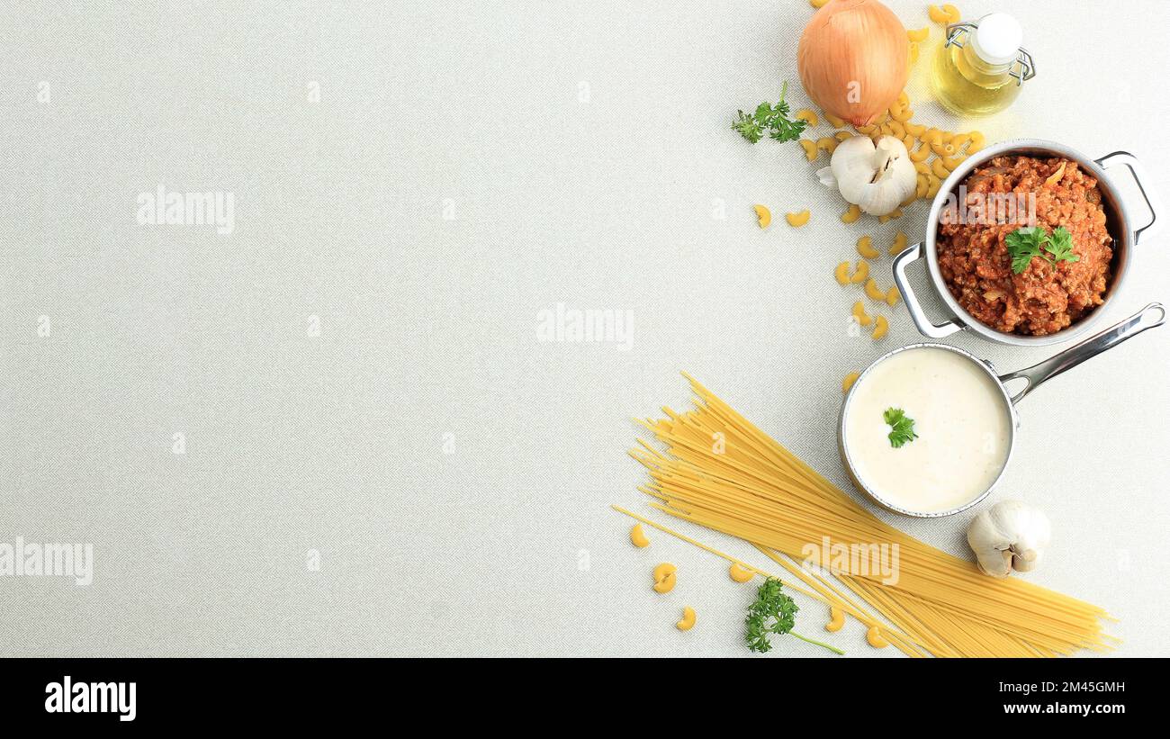 Dry Pasta with Bolognaise Sauce and Bechamel Sauce, Ingredient Making Lasagna. Banner Size with Copy Space for Text Stock Photo