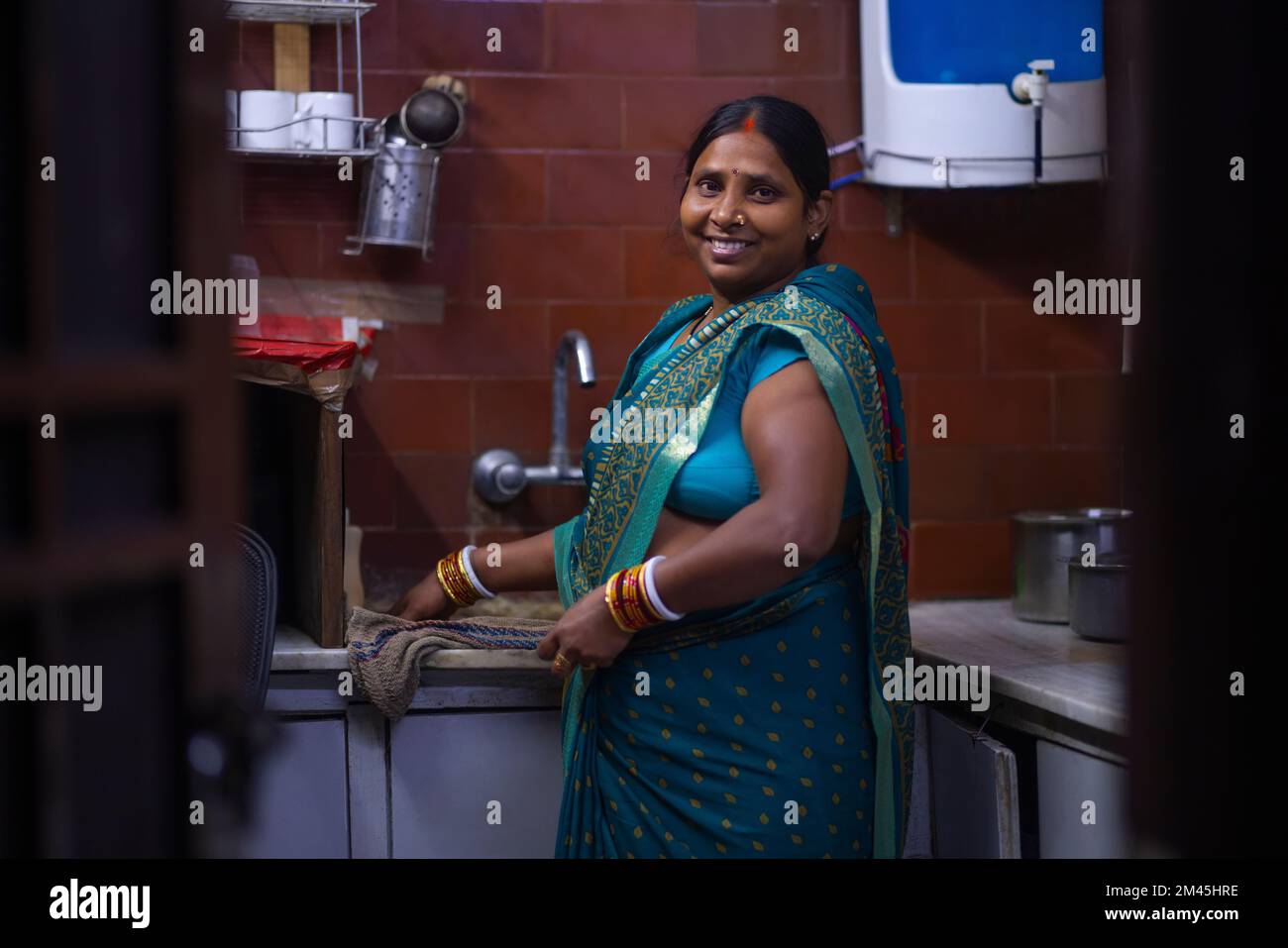 An Indian House Maid Working In The Kitchen Stock Photo Alamy