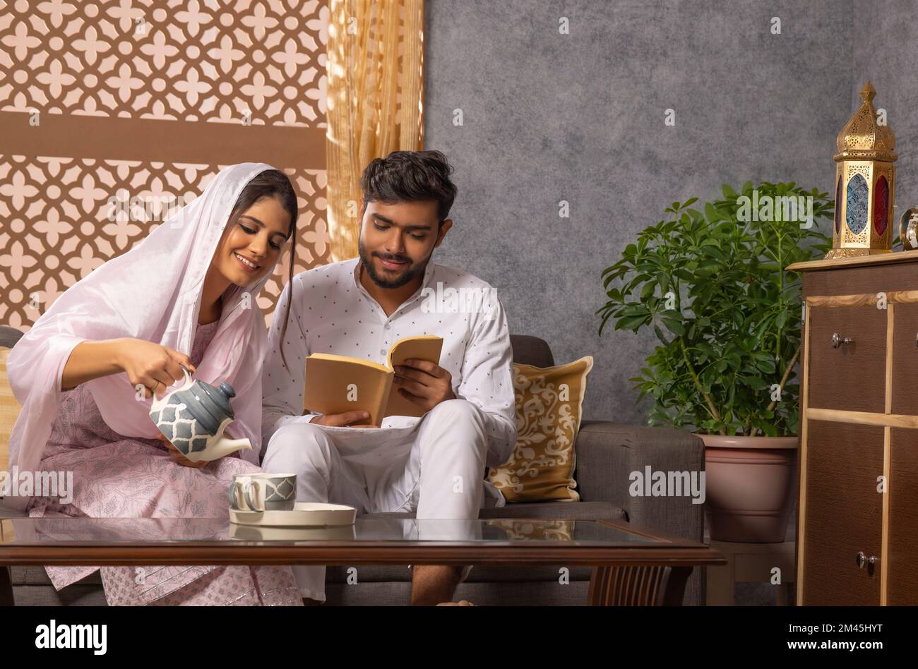 Woman making tea for husband hi-res stock photography and images - Alamy