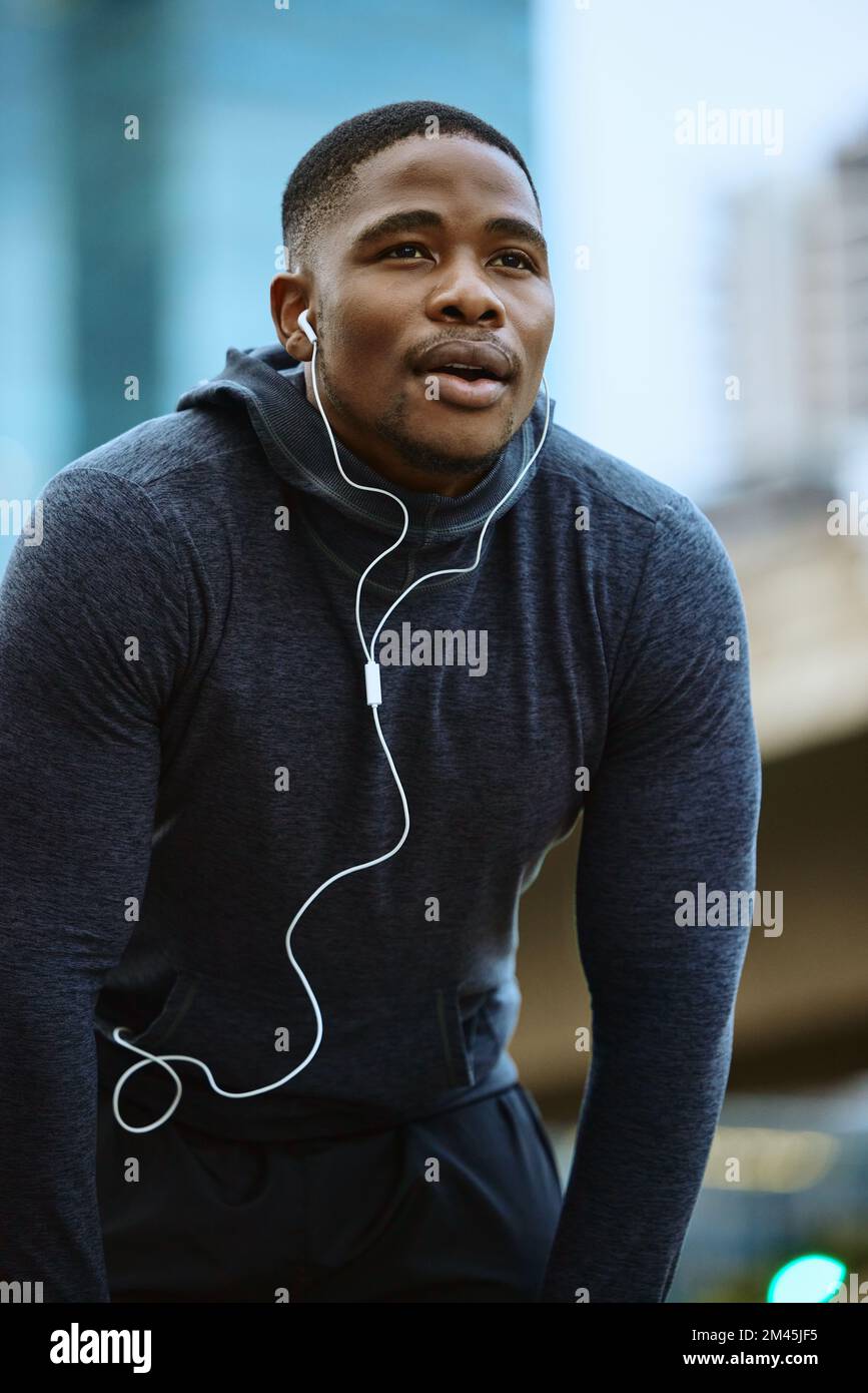 Breathe, black man and fitness break for city workout, wellness exercise and running outdoors. Runner, breathing and relax after cardio marathon with Stock Photo