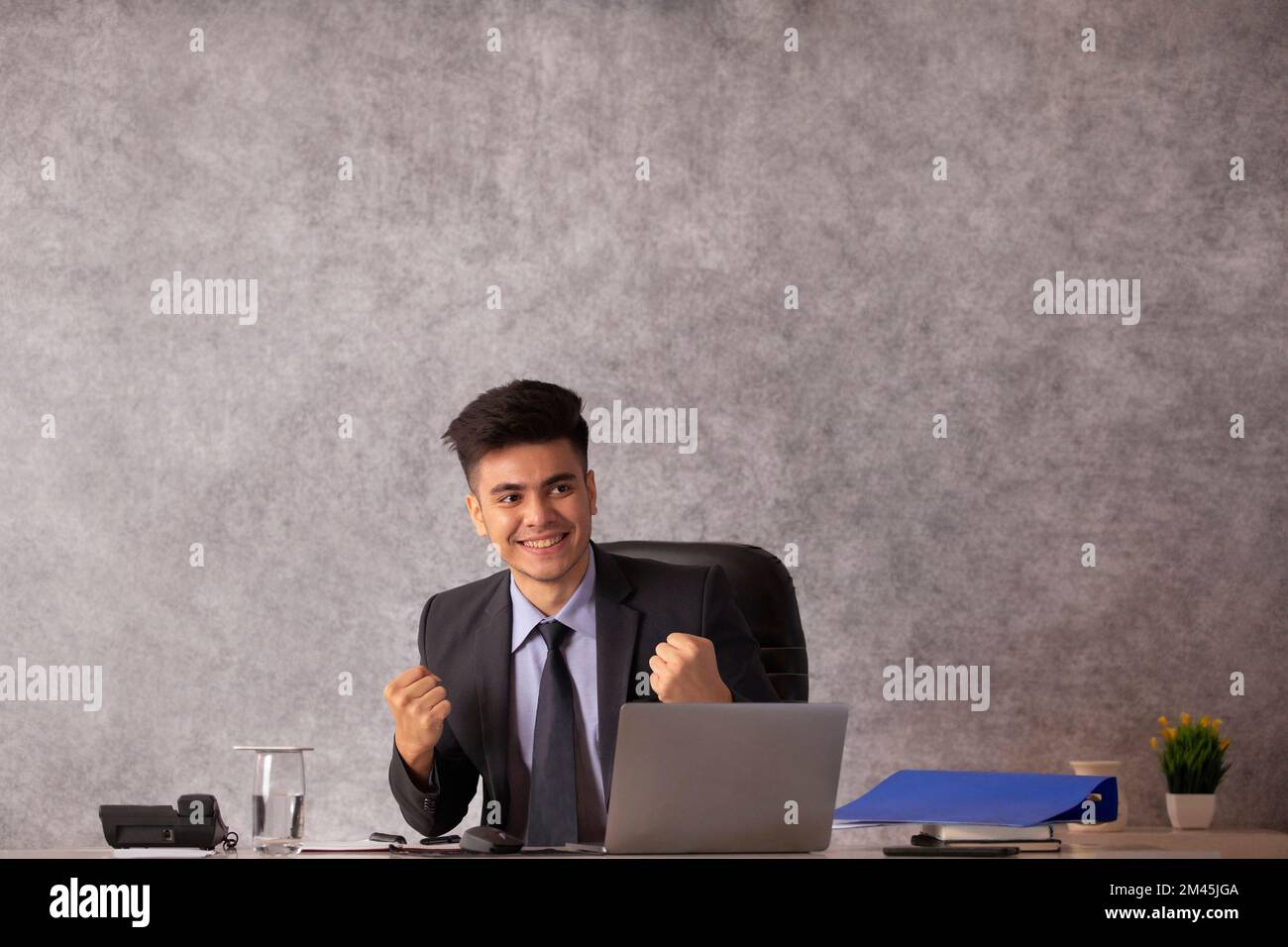 Businessman cheering at office desk hi-res stock photography and images ...