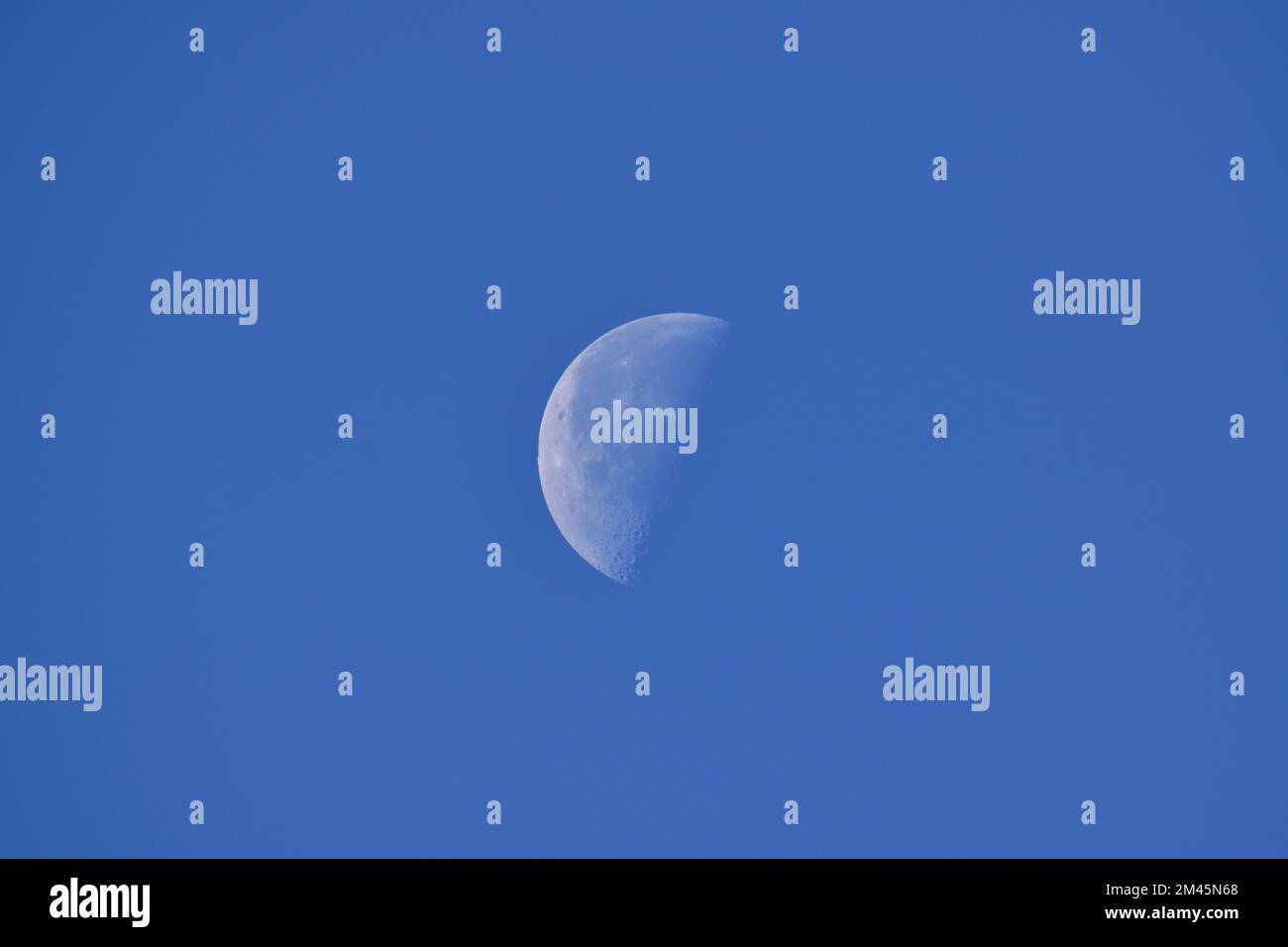 Craters on the surface of a crescent moon Stock Photo - Alamy