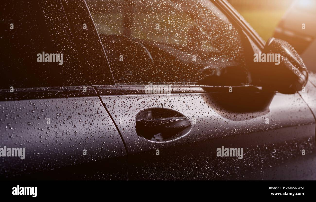 Clean car windshield with multiple water drops on after heavy rain and dew water  repellent surface treatment Stock Photo - Alamy