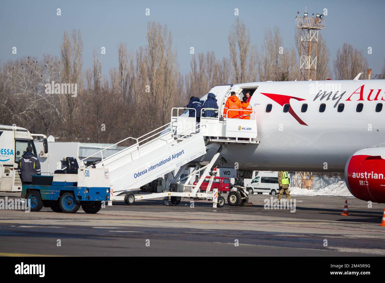 Odessa, Ukraine SIRCA 2018: Passenger plane my Austrian airline at airport in winter. Landing passengers in airliner in winter during snowstorm. Moder Stock Photo