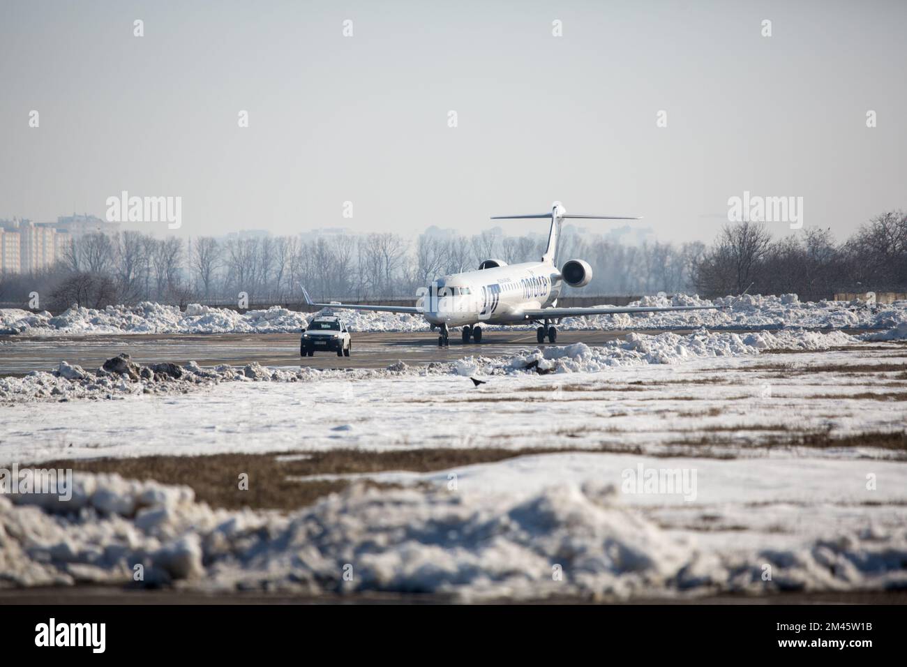 Odessa, Ukraine SIRCA 2018: Aircraft LOT with a Follow-me Car at airport in winter Stock Photo