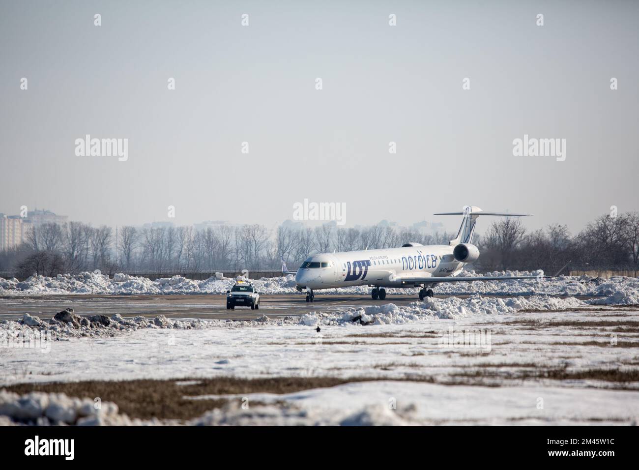 Odessa, Ukraine SIRCA 2018: Aircraft LOT with a Follow-me Car at airport in winter Stock Photo