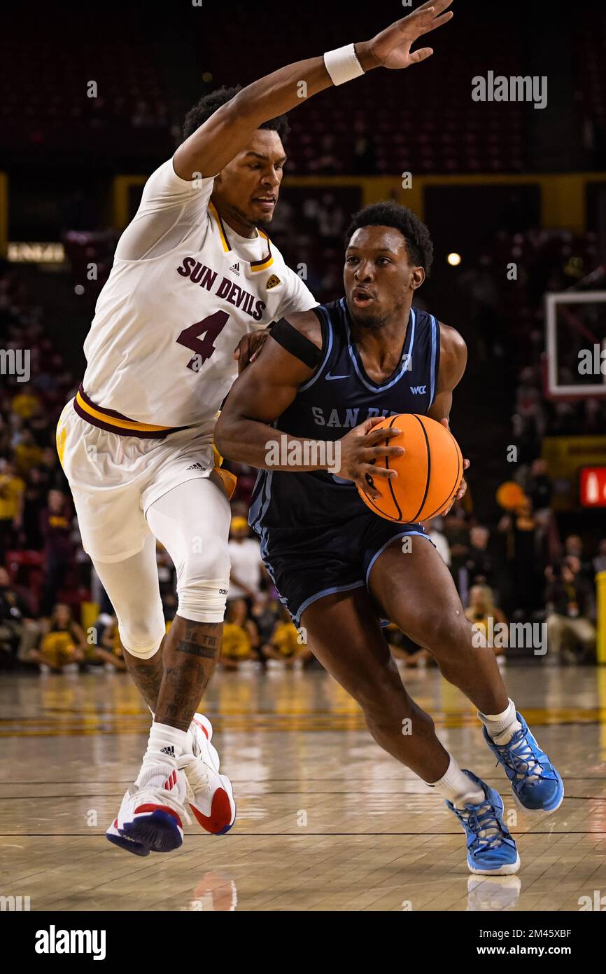University of San Diego guard Wayne McKinney III (3) drives towards the basket in the first half of the NCAA basketball game against Arizona State in Stock Photo