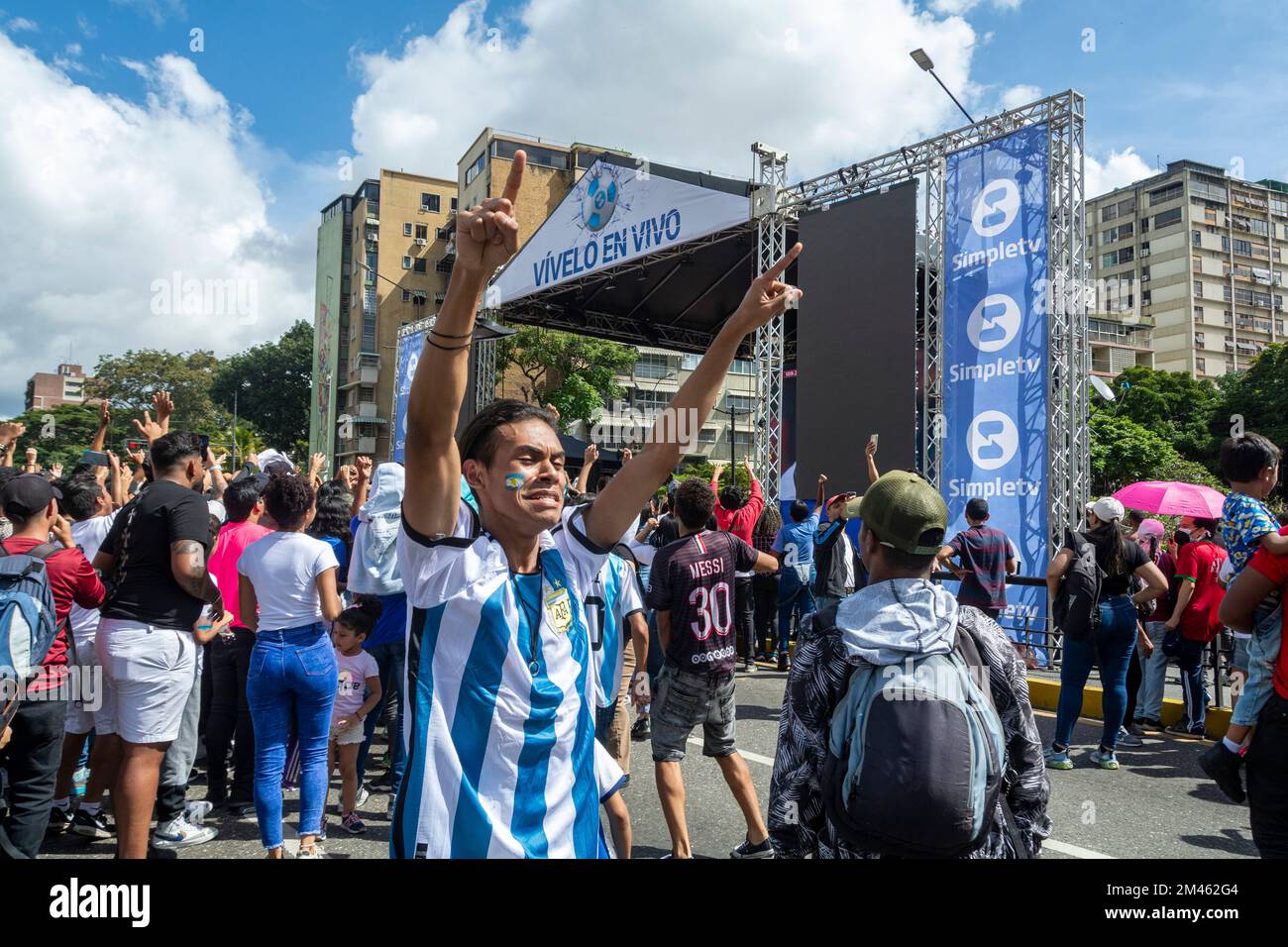 Fans watch the final of the 2022 FIFA World Cup in Caracas (Venezuela) between Argentina and France. Giant screens have been installed in different sq Stock Photo