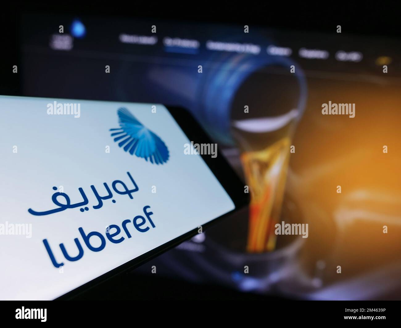 Smartphone with logo of Saudi Arabian base oil company Luberef on screen in front of business website. Focus on center-left of phone display. Stock Photo