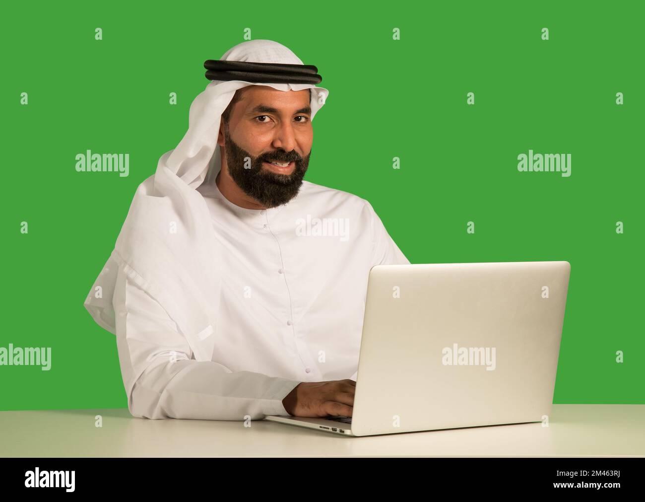 Emirati man working on a laptop. Stock Photo