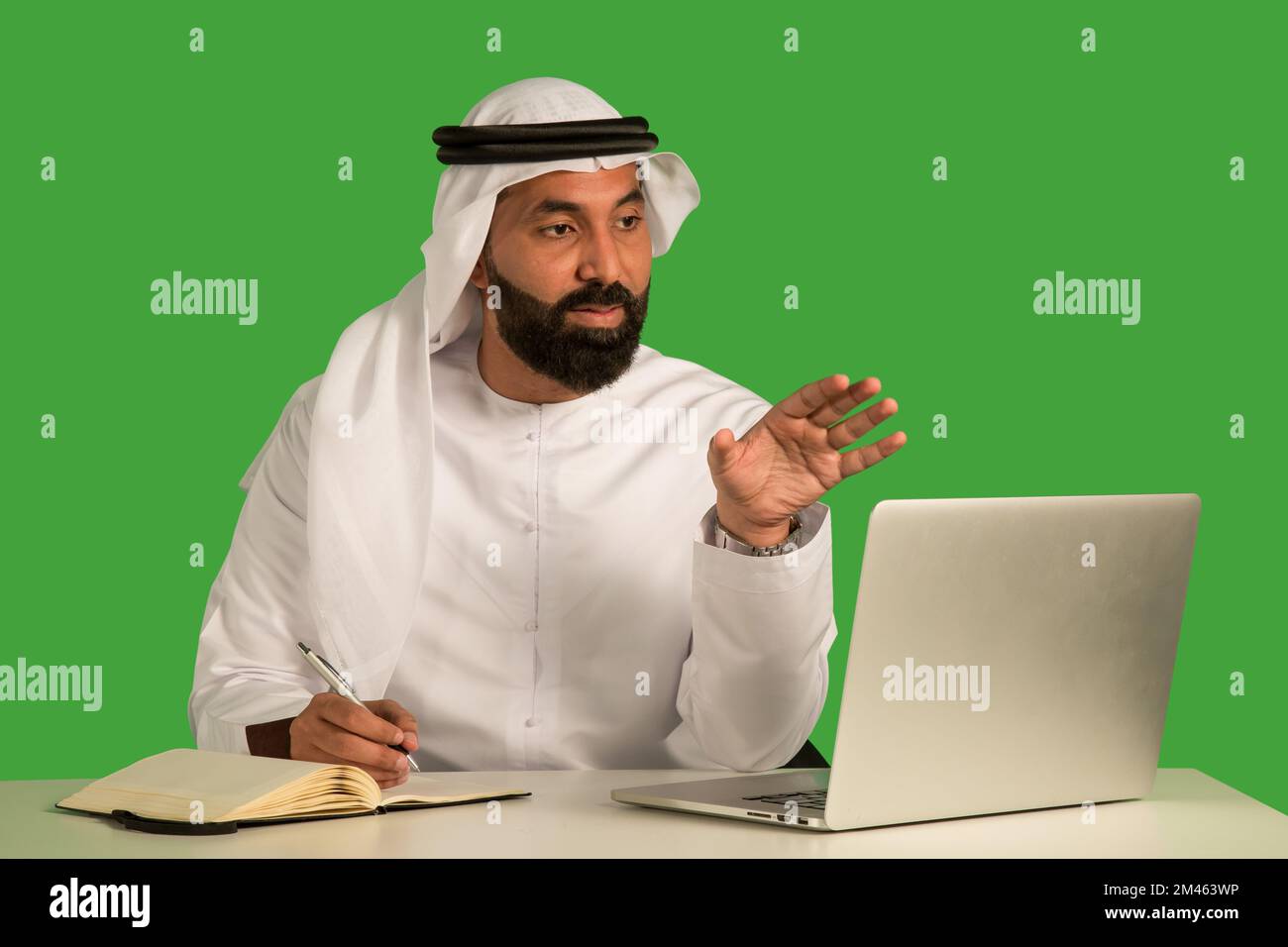 Emirati man working on a laptop. Stock Photo