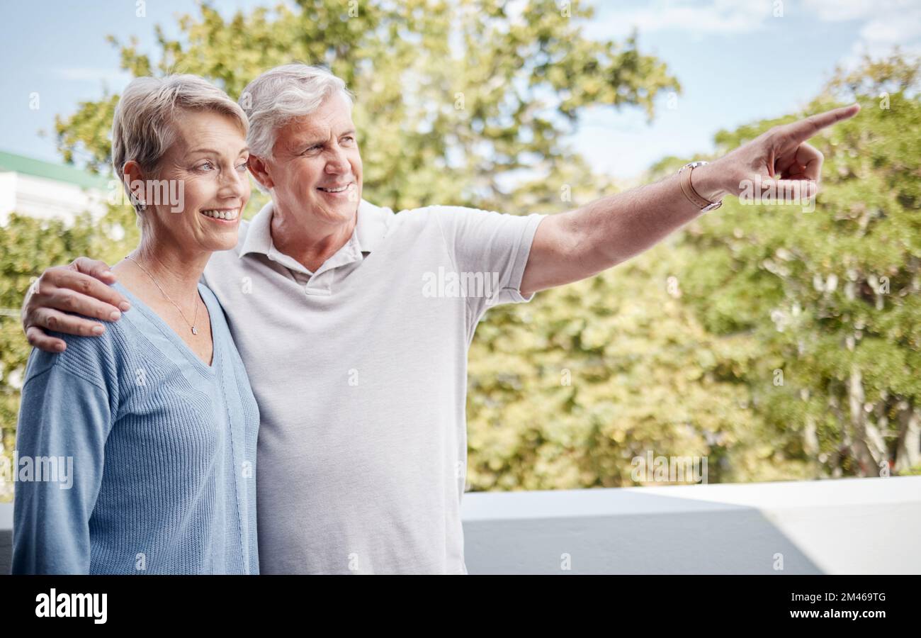 Senior couple, bonding or pointing on house balcony or home garden trees, backyard plant growth or Australian wild birdlife. Smile, happy or hug for Stock Photo