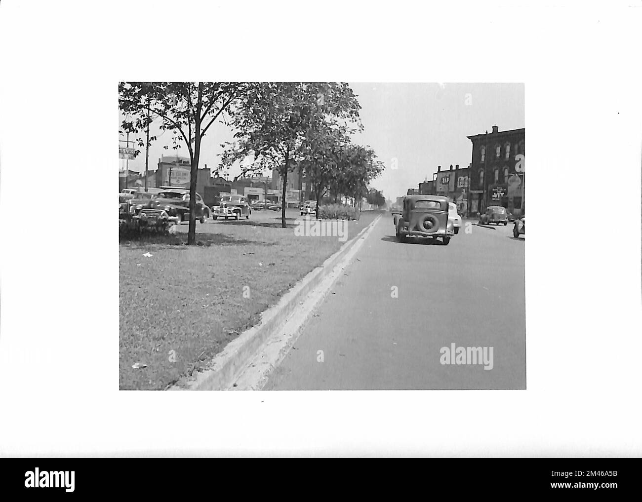 Four lane streets with parking and ten foot median in center, Ogden Avenue. Original caption: Four lane streets with parking and ten foot median in center. Ogden Ave. Photo by T. W. Kines. July 26, 1948. State: Illinois. Place: Chicago. Stock Photo