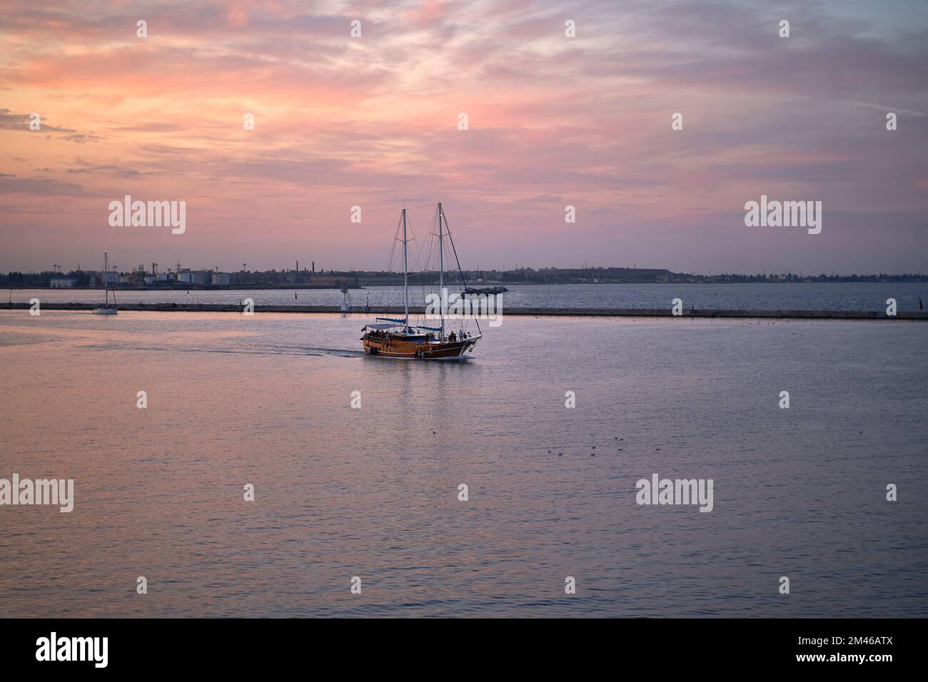 wooden yacht in port. Passenger sailing yacht with a wooden hull