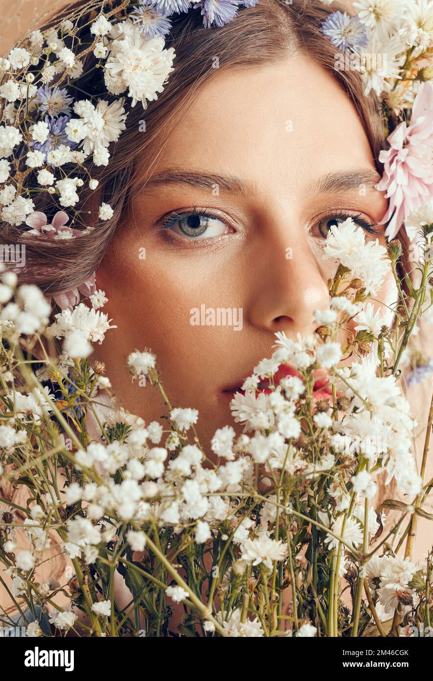 Woman, beauty and flower portrait for natural skincare, cosmetics makeup and floral head crown. Spring flowers, organic body care and skin wellness Stock Photo