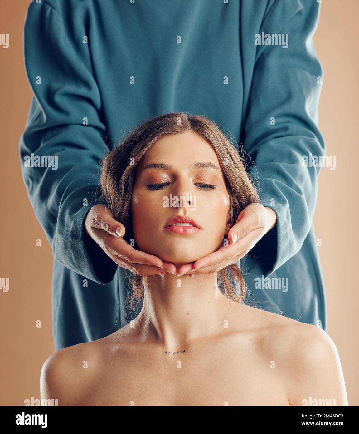 Beauty, fashion and women hands on face in studio for skincare, cosmetics and beauty salon treatment. Creative spa, aesthetic and girl holding head of Stock Photo