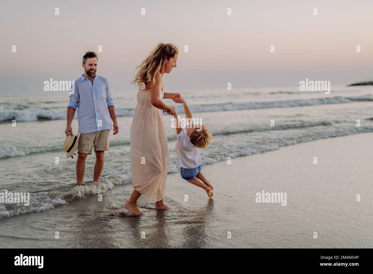 Happy family with little son enjoying time at sea in exotic country. Stock Photo