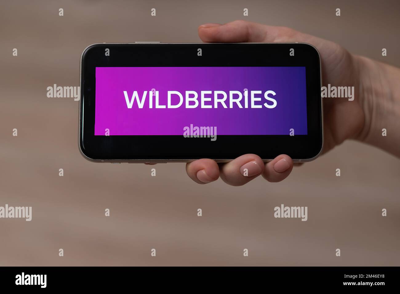 December 3, 2022, Almaty, Kazakhstan: wildberries logo on the screen of a smartphone in a female hand.  Stock Photo