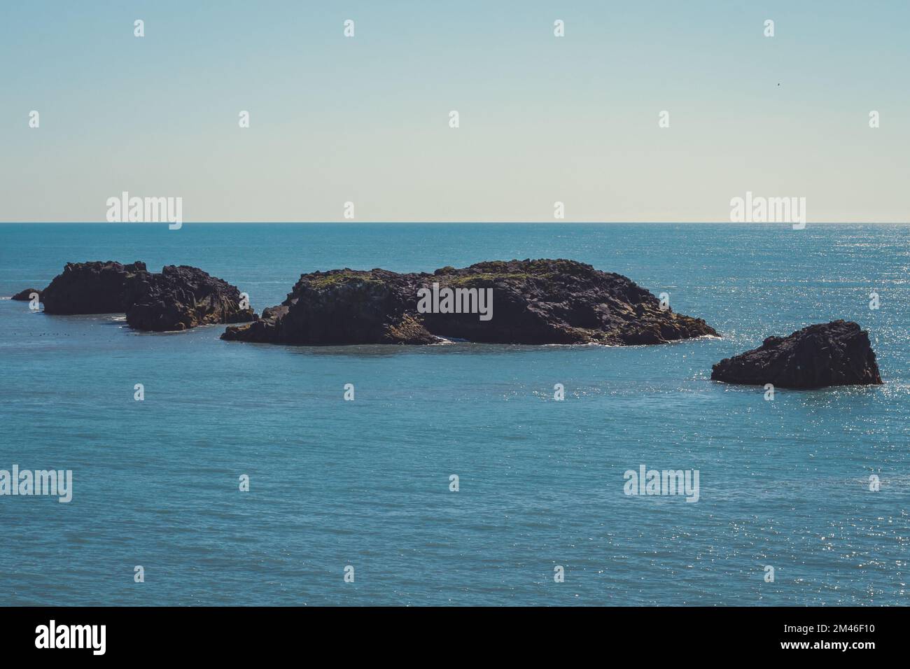 Large rocks in sea water landscape photo Stock Photo - Alamy