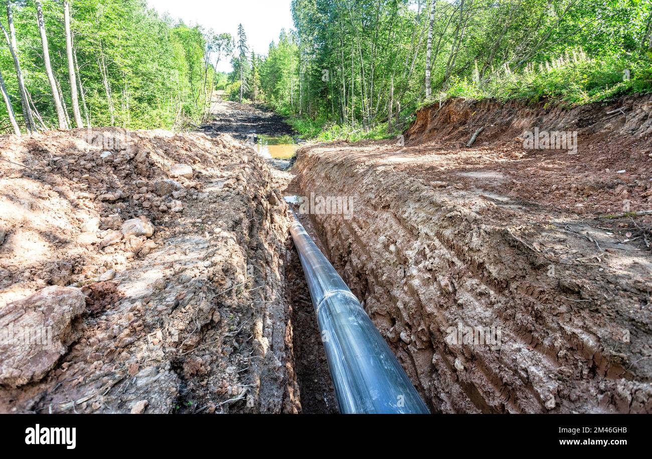 laying-a-plastic-gas-pipeline-pipe-in-a-trench-in-the-summer-gas