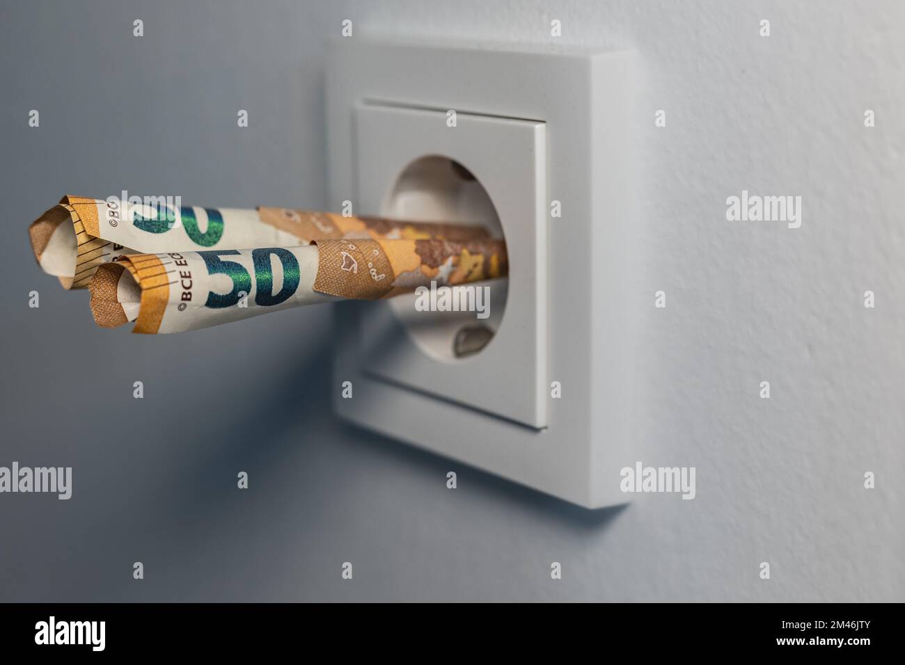 Banknotes stuck in a socket Stock Photo