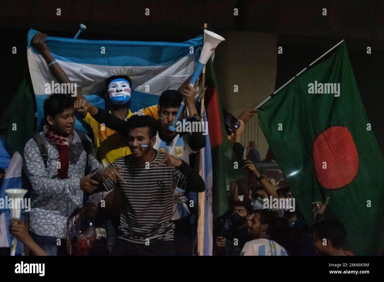 Bangladesh. 18th Dec, 2022. Fans celebrate the victory of Argentina against France in a FIFA World Cup Qatar 2022 final match, at the University of Dhaka area. Argentina won their third World Cup in extraordinary style, beating France 4-2 in a penalty shootout after Messi scored twice in a 3-3 draw that featured a hat-trick for Kylian Mbappe as the French team recovered from 2-0 down after 80 minutes. (Credit Image: © Jubair Ahmed Arnob/Pacific Press via ZUMA Press Wire) Stock Photo