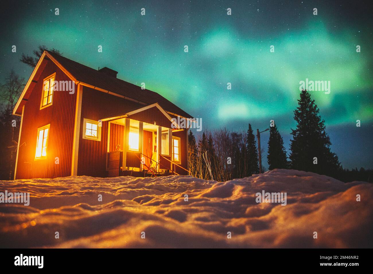 Aurora borealis over wooden house Stock Photo - Alamy