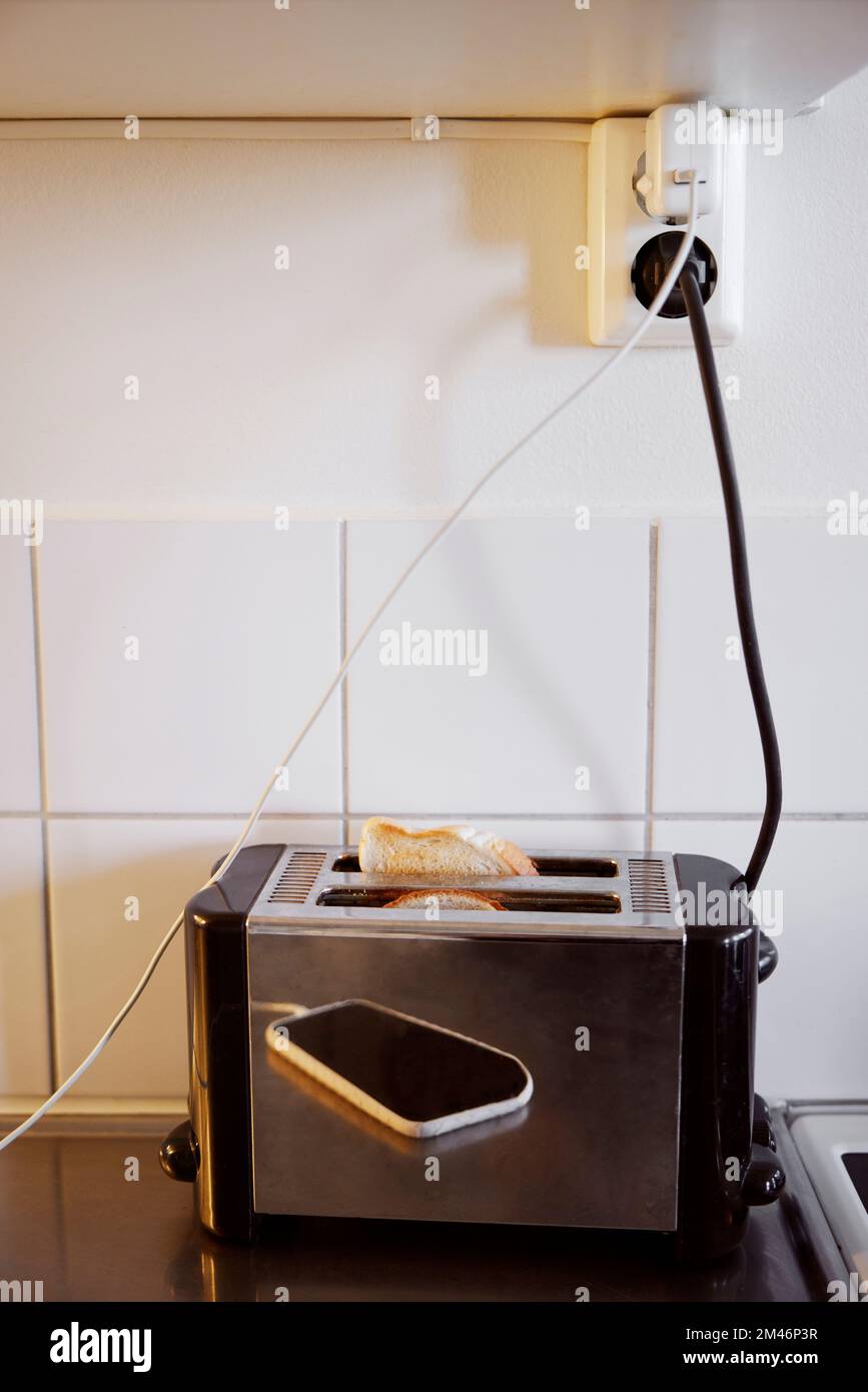 Toaster plugged into an outlet Stock Photo Alamy