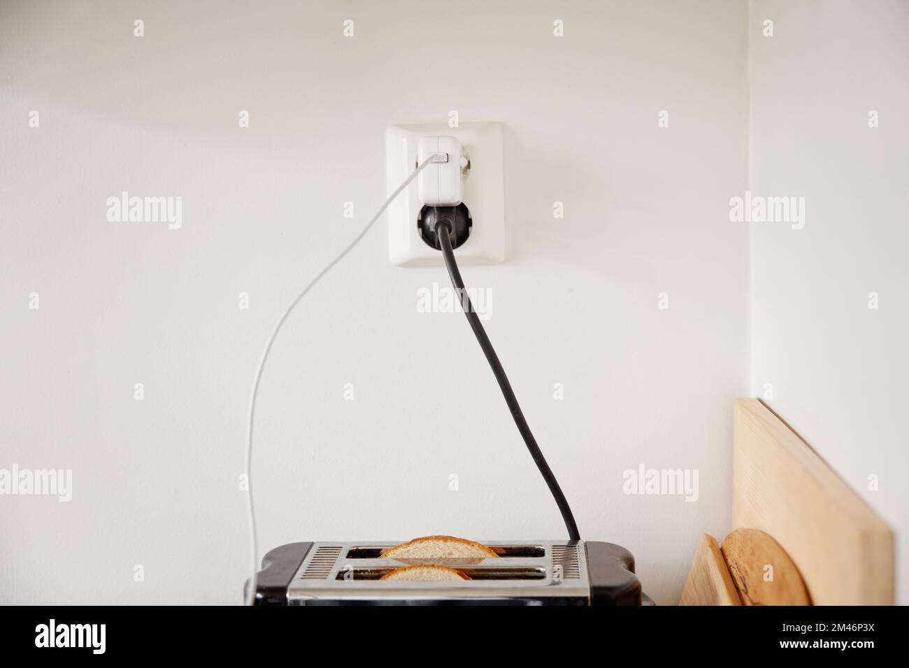 Toaster plugged into an outlet Stock Photo Alamy