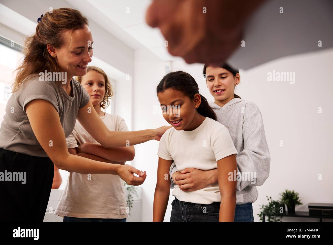 Teachers and children in first aid class Stock Photo