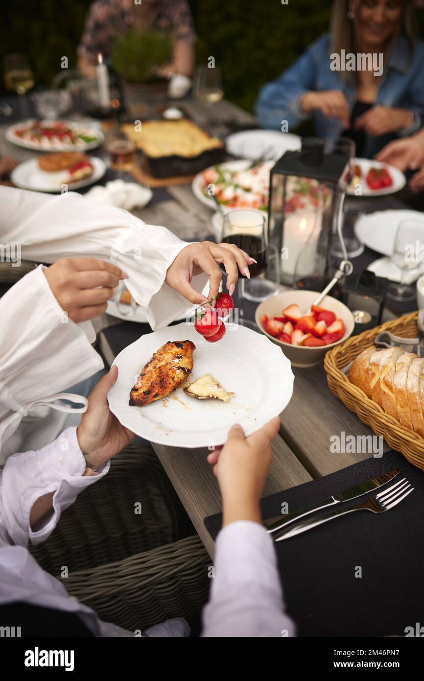 Having supper hi-res stock photography and images - Alamy