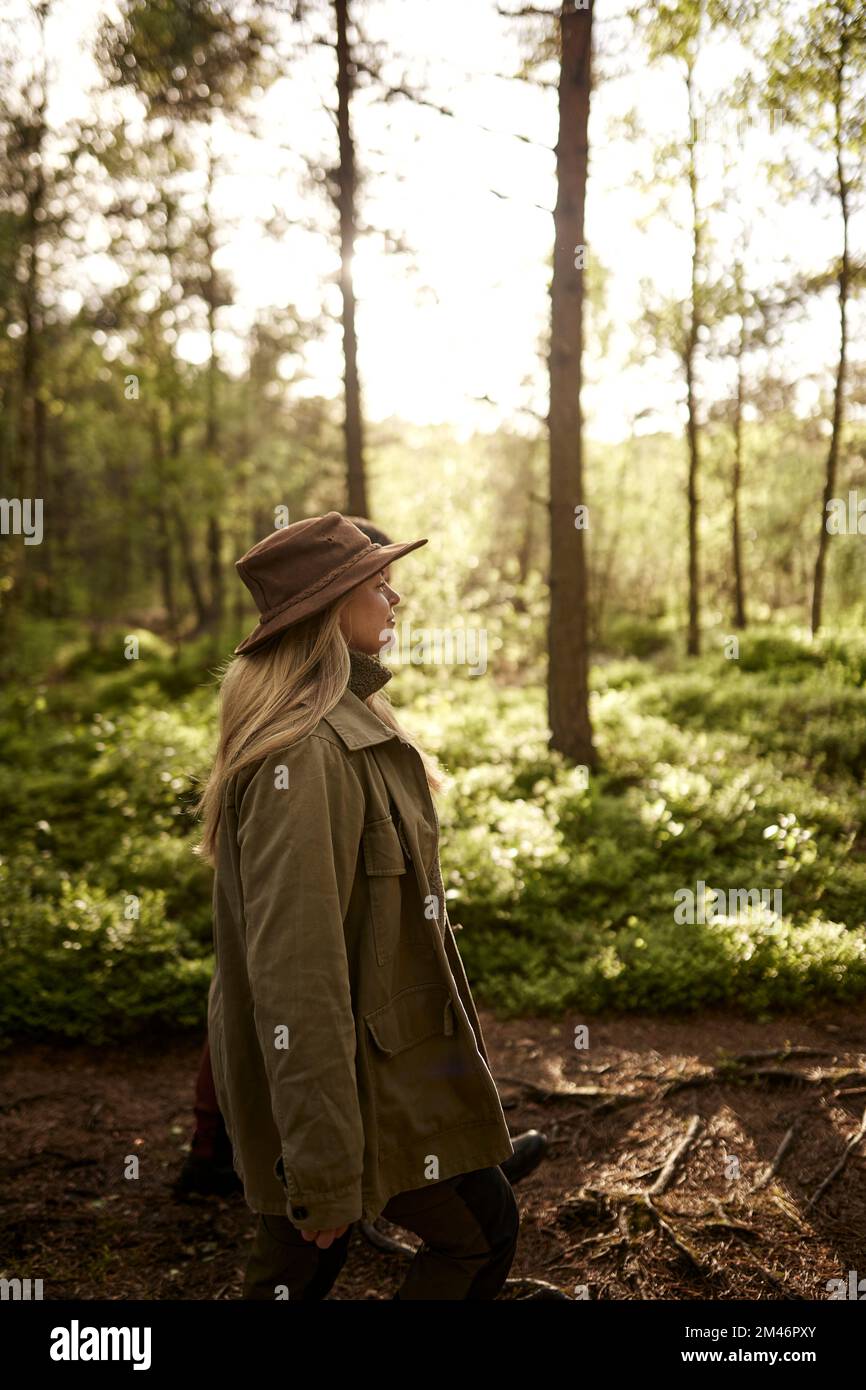 Mature woman walking through forest hi-res stock photography and images ...