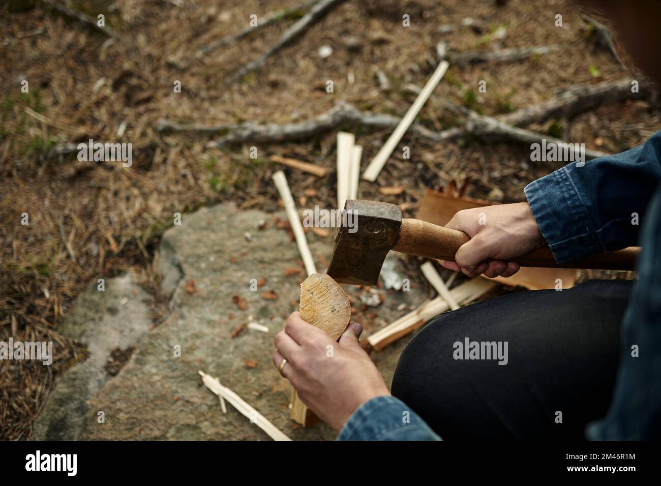 Hands with axe chopping wood Stock Photo Alamy