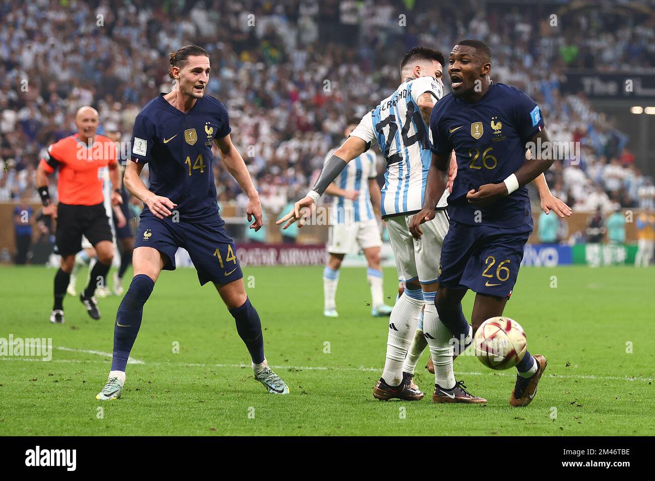 Lusail City, Qatar. 18th Dec, 2022. Enzo Fernandez (C) of Argentina in action with Marcus Thuram (R) of France during the 2022 FIFA World Cup Final at Lusail Stadium in Lusail City, Qatar on December 18, 2022. Photo by Chris Brunskill/UPI Credit: UPI/Alamy Live News Stock Photo
