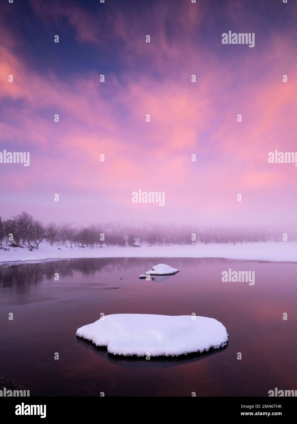 Sunset over winter lake Stock Photo