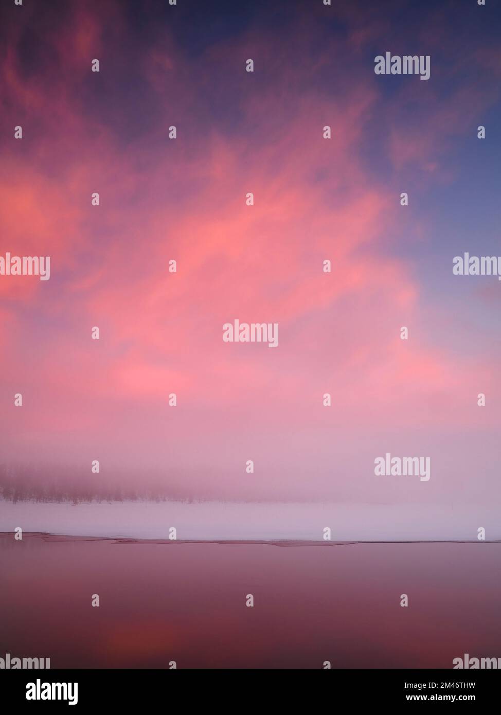 Sunset over winter lake Stock Photo
