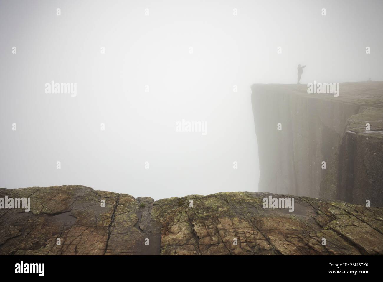 Rocky cliffs at foggy day Stock Photo - Alamy