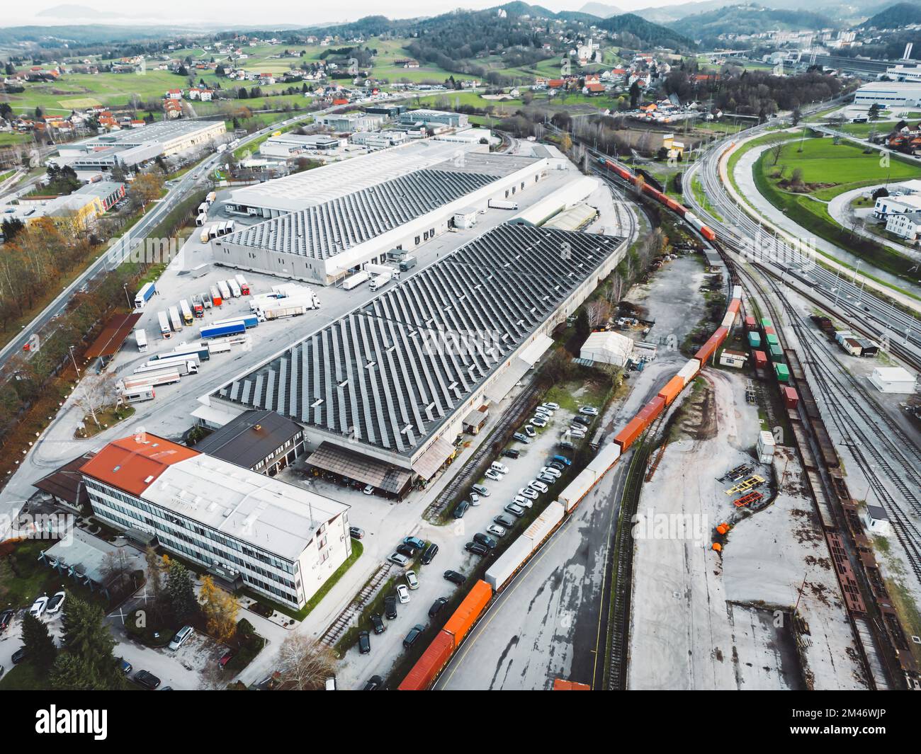 Drone view, industrial area with rooftops of the buildings covered in solar panels  Stock Photo