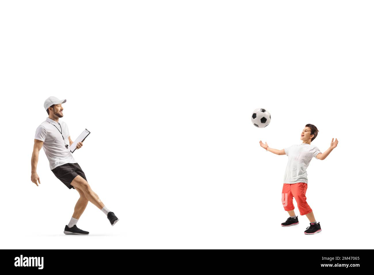 Football coach praticing with a boy isolated on white background Stock