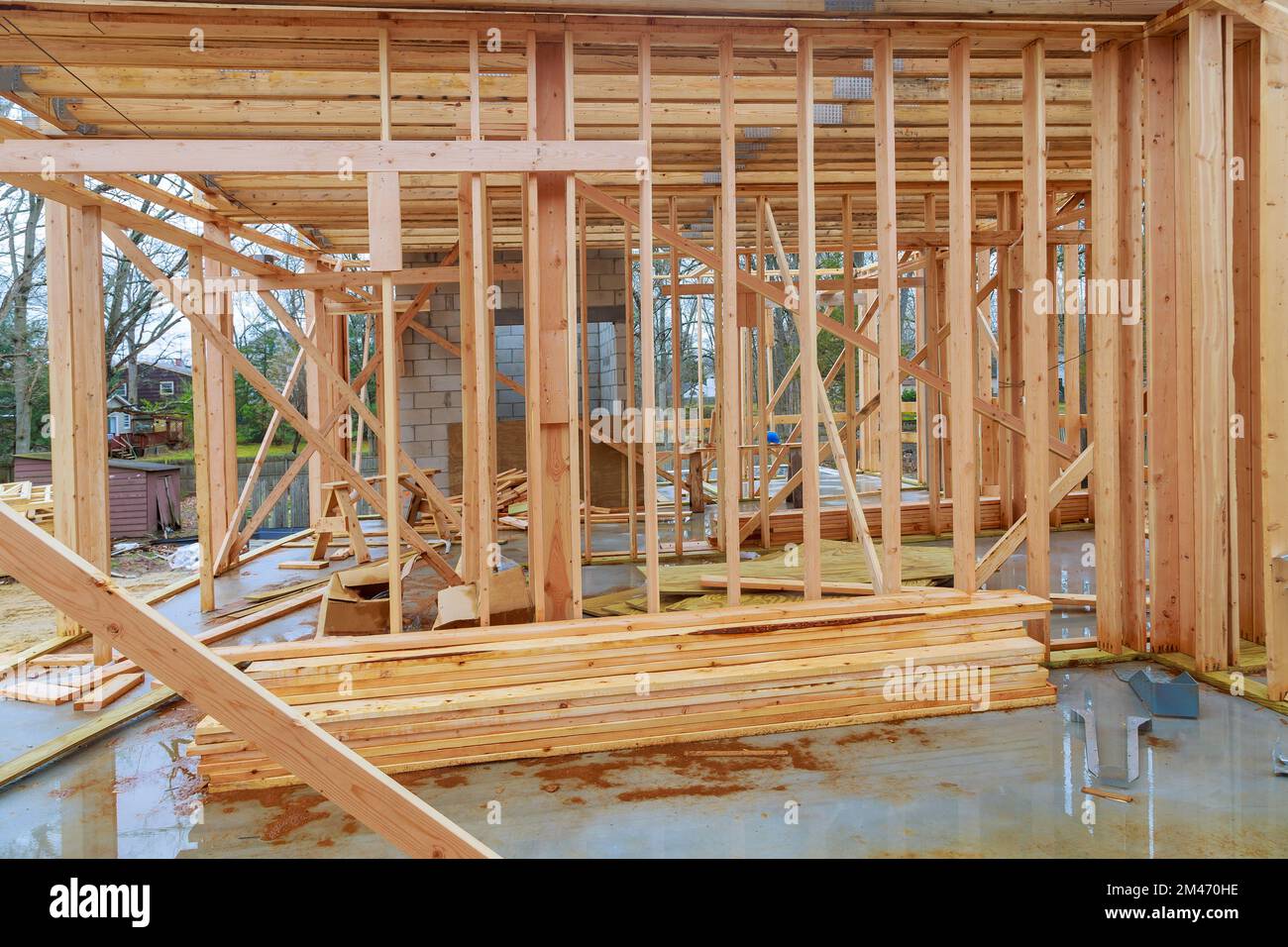 An view of timber framing beams framework in a built new house under construction Stock Photo