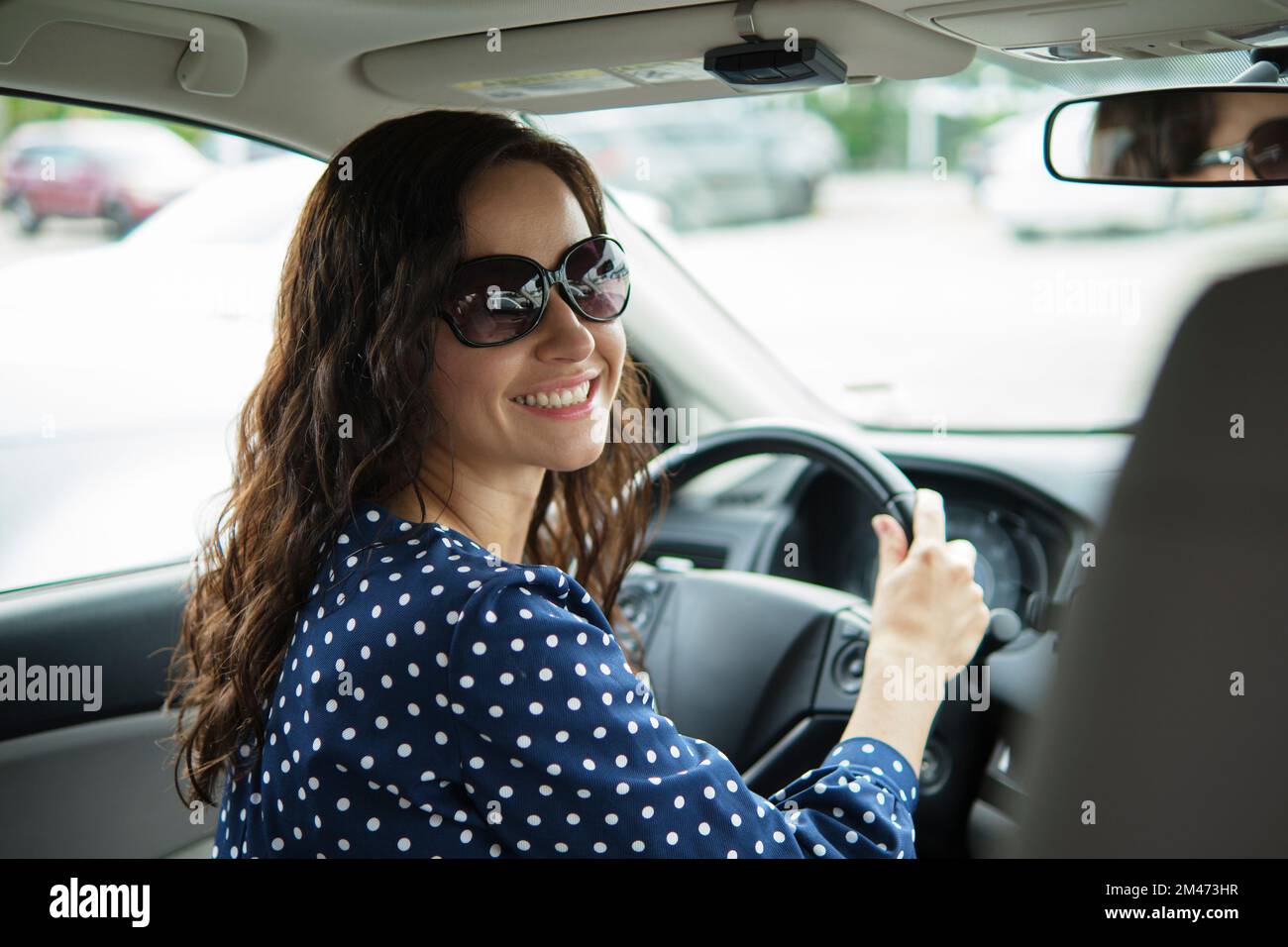Girl behind steering wheel hi-res stock photography and images - Alamy