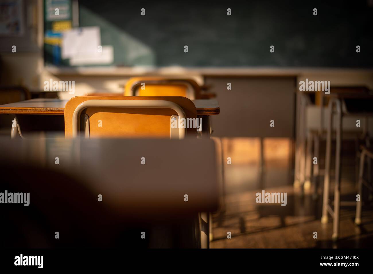 school chairs and desks in an empty Japanese school classroom Stock Photo