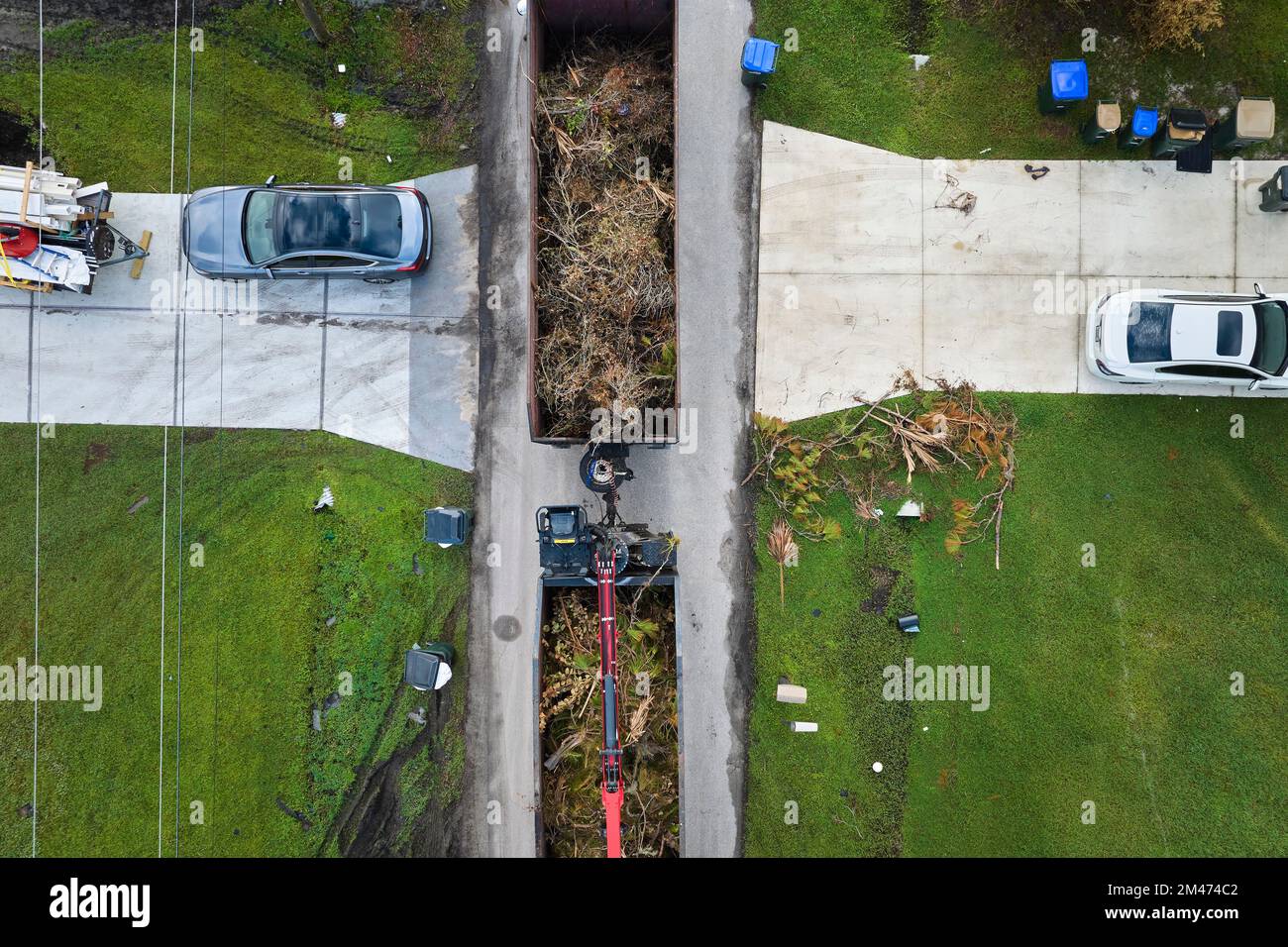 Top view of Hurricane Ian special aftermath recovery dump truck picking