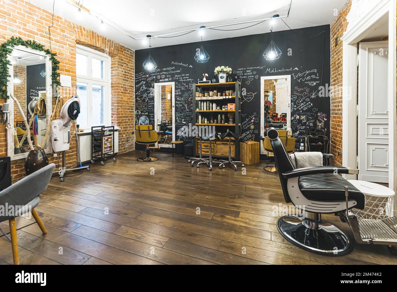 Industrial hairdresser's salon. Full indoor shot with no people. Stylish interior of small haircut business. High quality photo Stock Photo