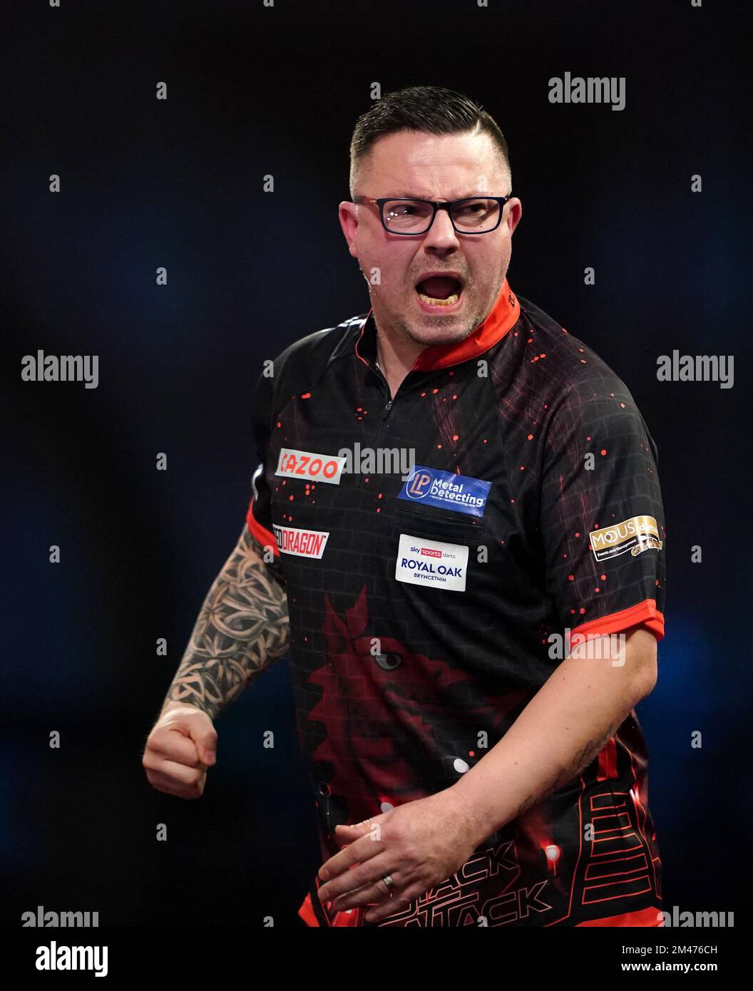 Wales' Robert Owen in action against England's Andrew Gilding during