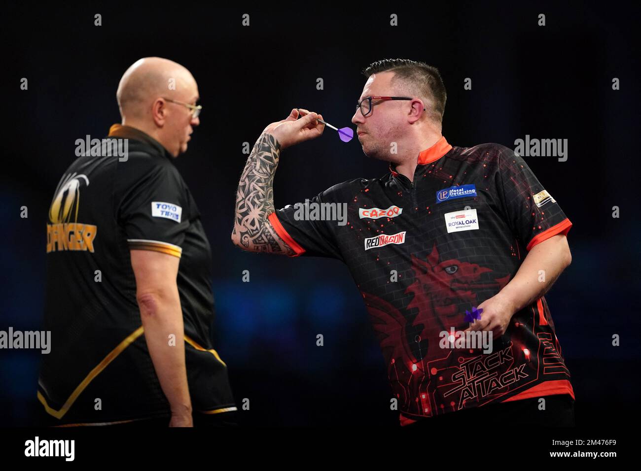 Wales' Robert Owen in action against England's Andrew Gilding during