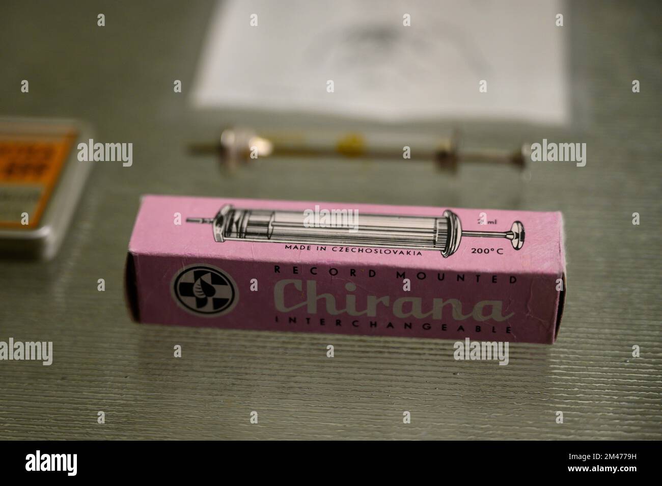 A historical reusable glass syringe from the Czechoslovak manufacturer Chirana. (Material: glass and surgical steel, made between 1935 and 1945). Stock Photo
