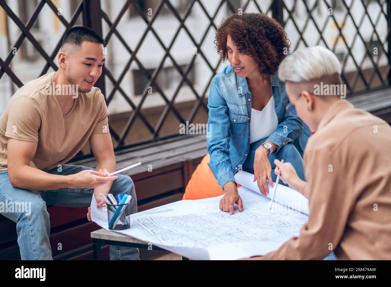 Group of architects working on a building project Stock Photo